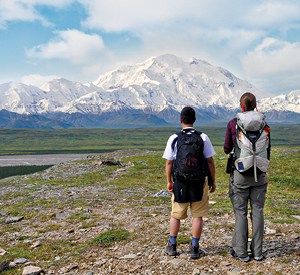 Two people look at Denali. Photo by Asia Bauzon.